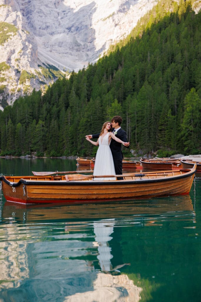 Elopement portraits at Lago di Braies, Italy, at sunrise